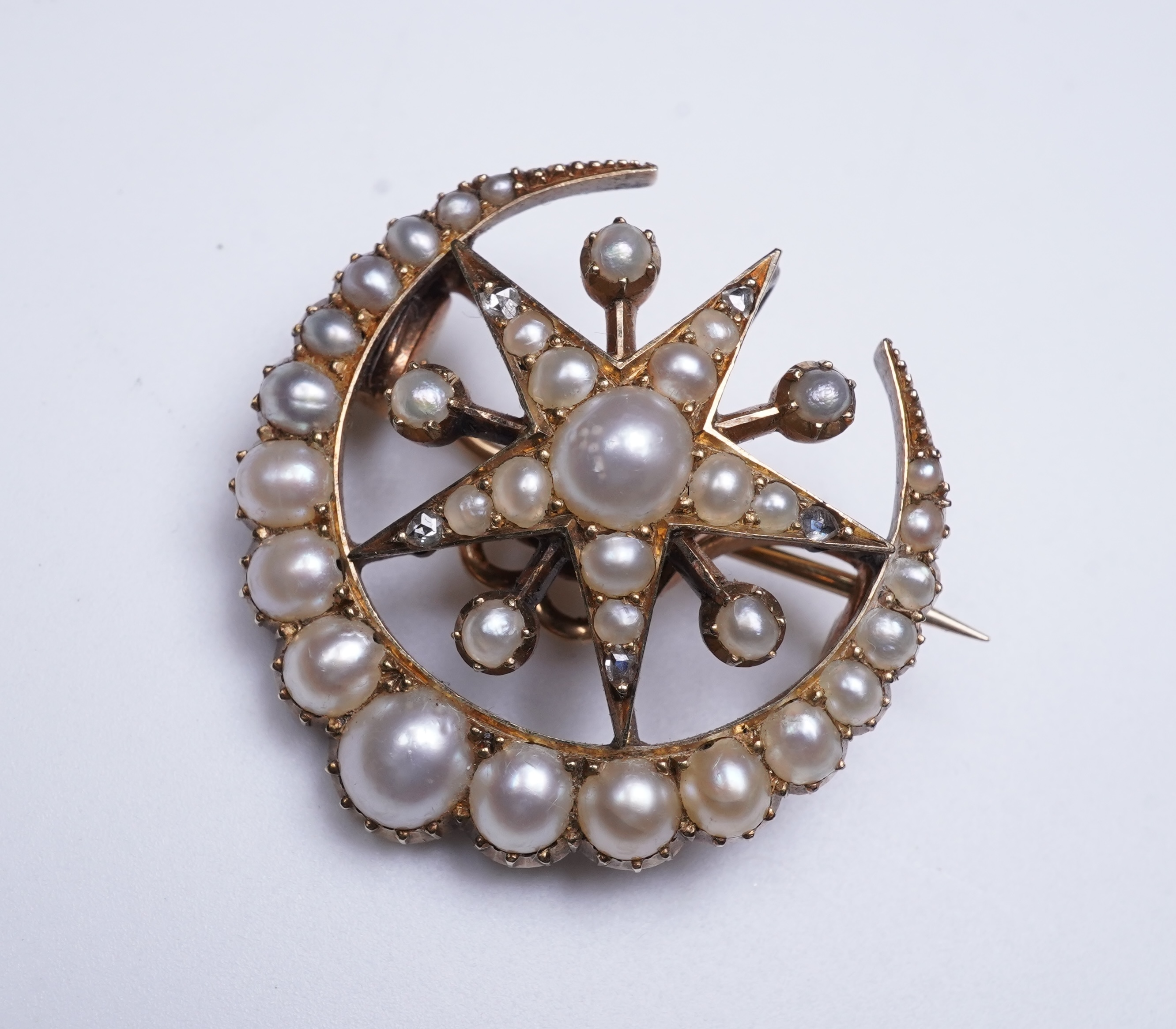 An Edwardian half pearl and diamond brooch, early 20th century